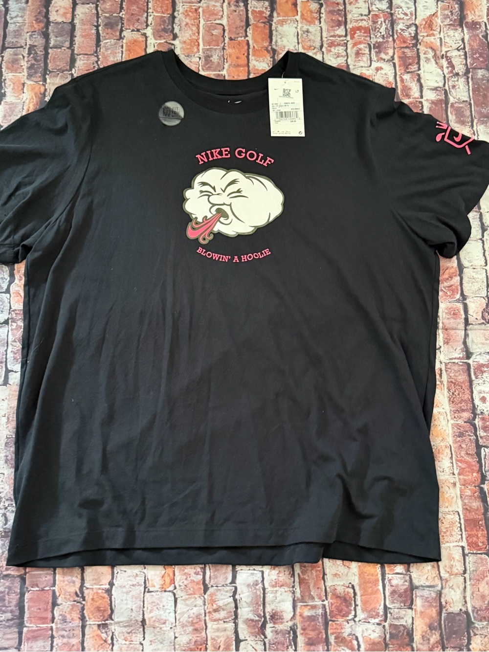 Nike Black Short-Sleeve Golf Tee with Pink and White Graphic